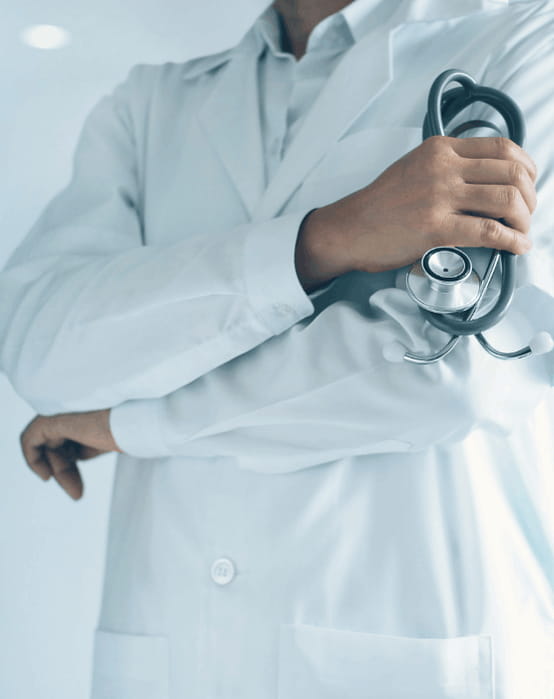 Doctor in white coat holding a stethoscope