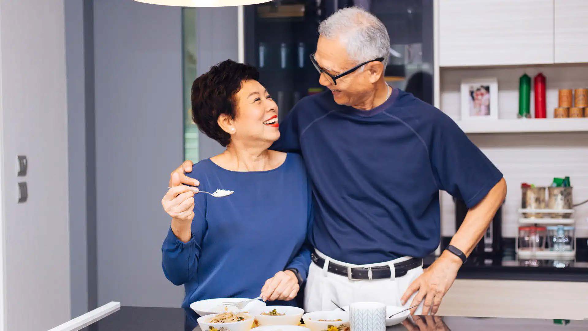 How to help someone recover from surgery - senior couple enjoying food together in kitchen